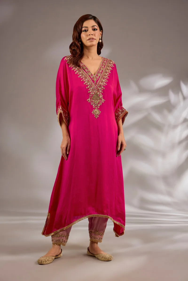 A-line kurta in satin organza base with dori hand embroidery.